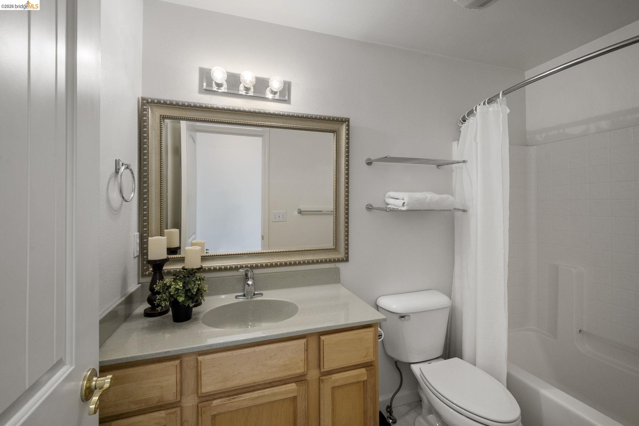 343 Field Stone Drive Murphys, CA 95247 - Photo 31 of 40 a bathroom with a sink vanity mirror and toilet