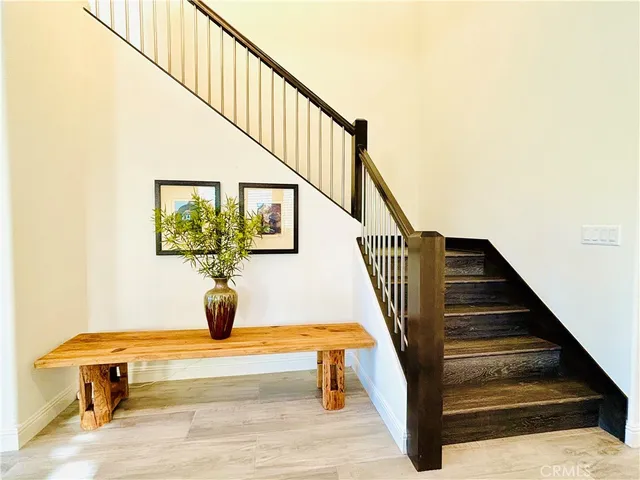 a room with a bed and a mirror