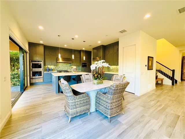 a spacious bedroom with a bed and a dresser