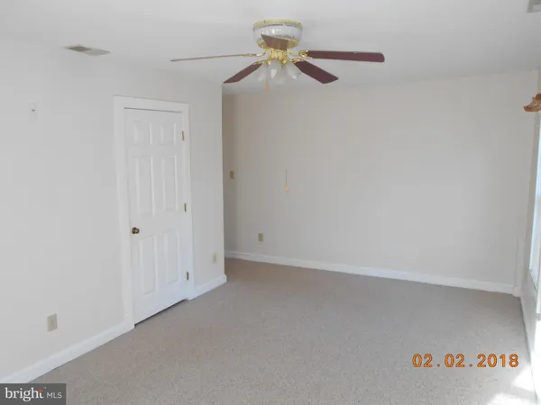 a view of a chandelier fan in a room