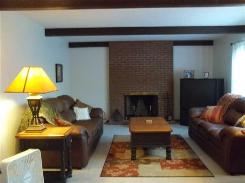 501 Engle Road Industry, PA 15052 - Photo 7 of 25 Living Room. 14X13 LIVINGROM WITH A BRICK LOG BURNING FIREPLACE.