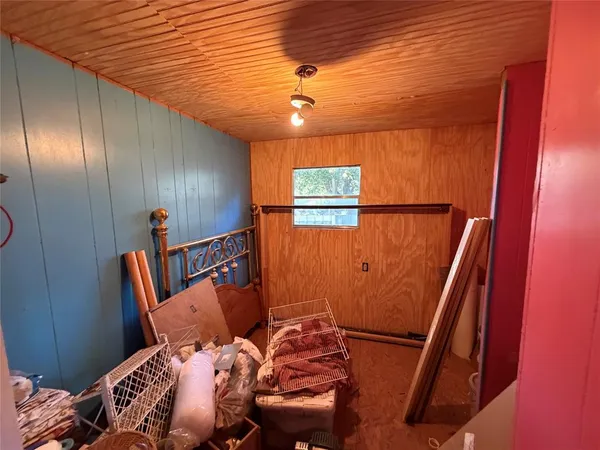 a bed room with furniture and a window