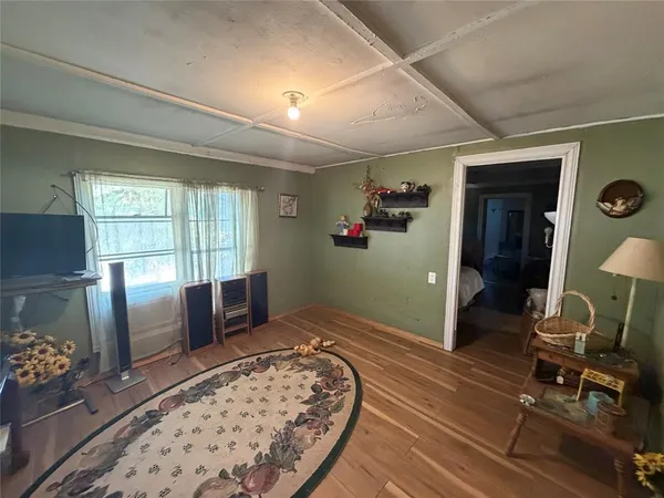 a bedroom with furniture and a window