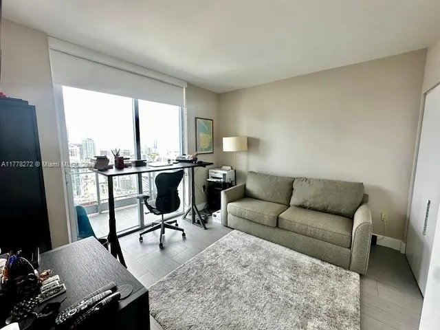 a living room with furniture and a window