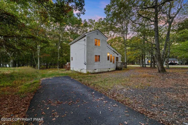 a house with trees in the background