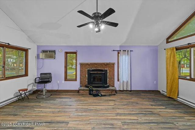 a view of livingroom with fireplace and window