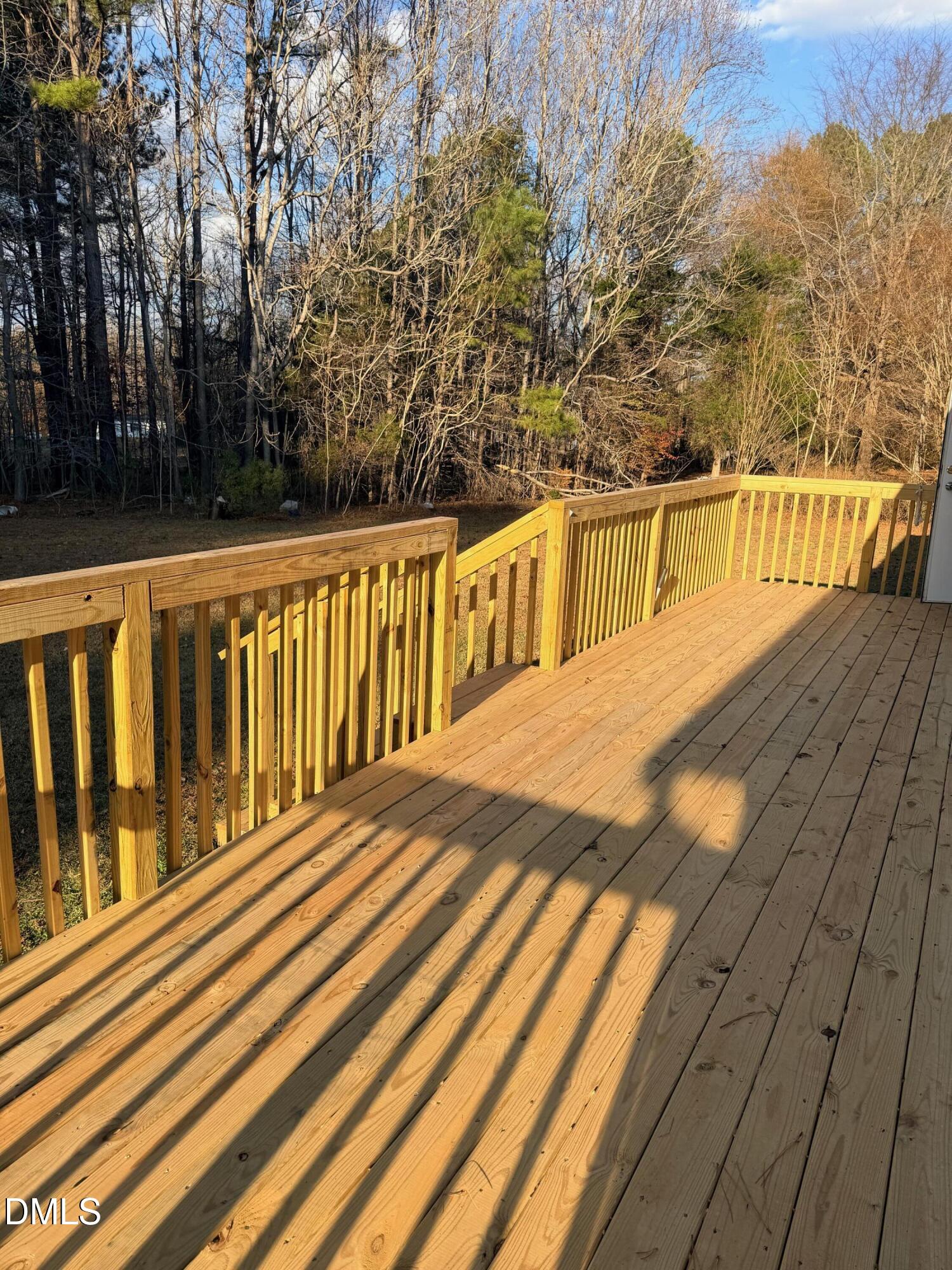 1185 Diamond Hills Road Stem, NC 27581 - Photo 13 of 14 a view of balcony with wooden floor and fence