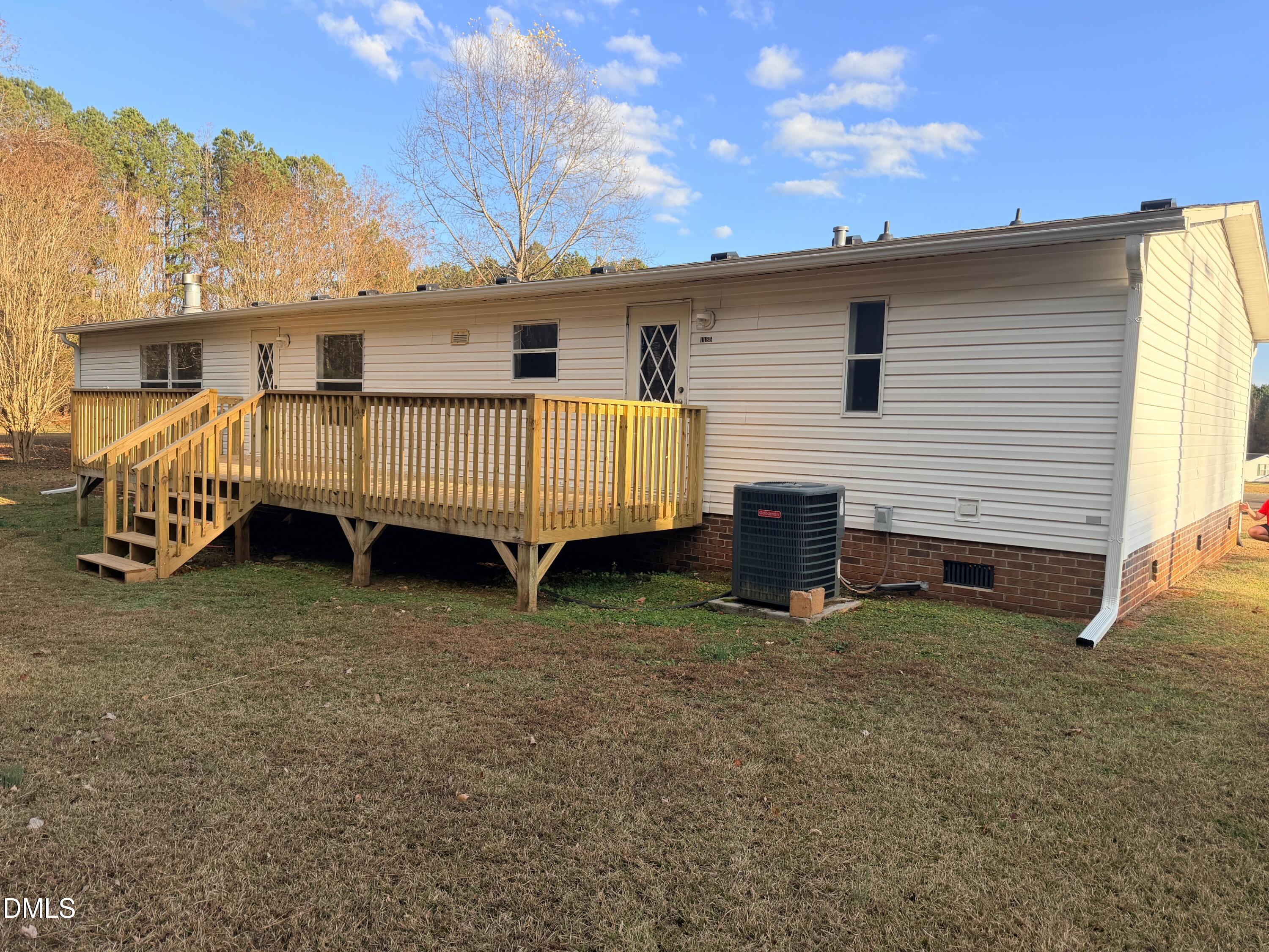 1185 Diamond Hills Road Stem, NC 27581 - Photo 14 of 14 a view of a house with a yard