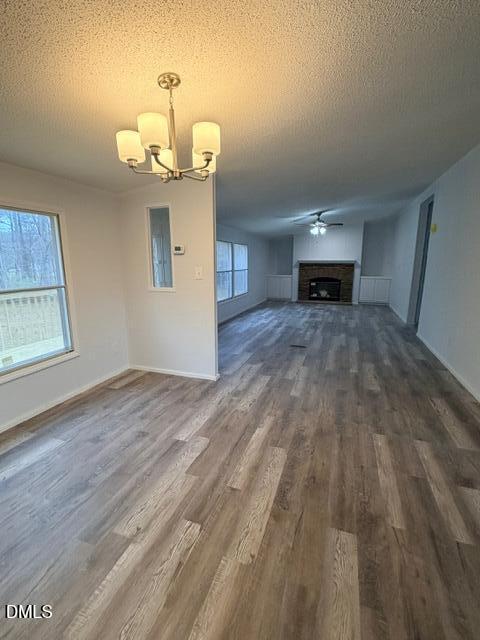 1185 Diamond Hills Road Stem, NC 27581 - Photo 6 of 14 a room with kitchen island a wooden floor and a window