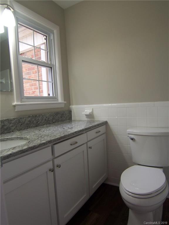 3804 Fallston Road Shelby, NC 28150 - Photo 12 of 24 a bathroom with a granite countertop toilet and sink
