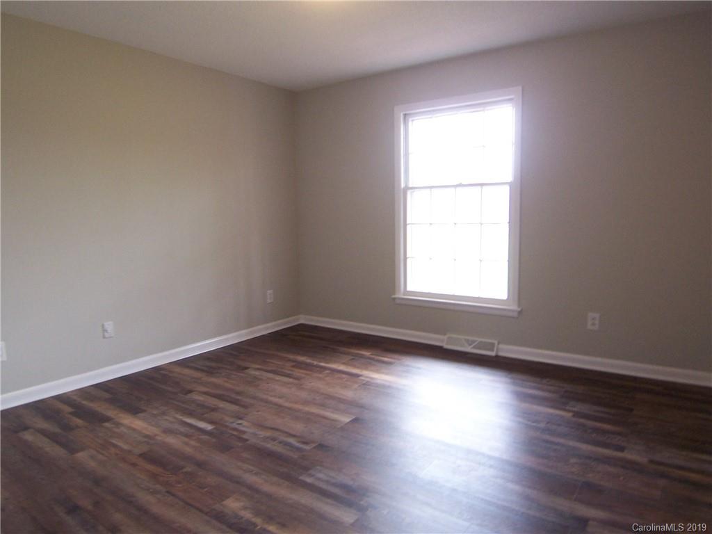 3804 Fallston Road Shelby, NC 28150 - Photo 14 of 24 a view of empty room with wooden floor and fan