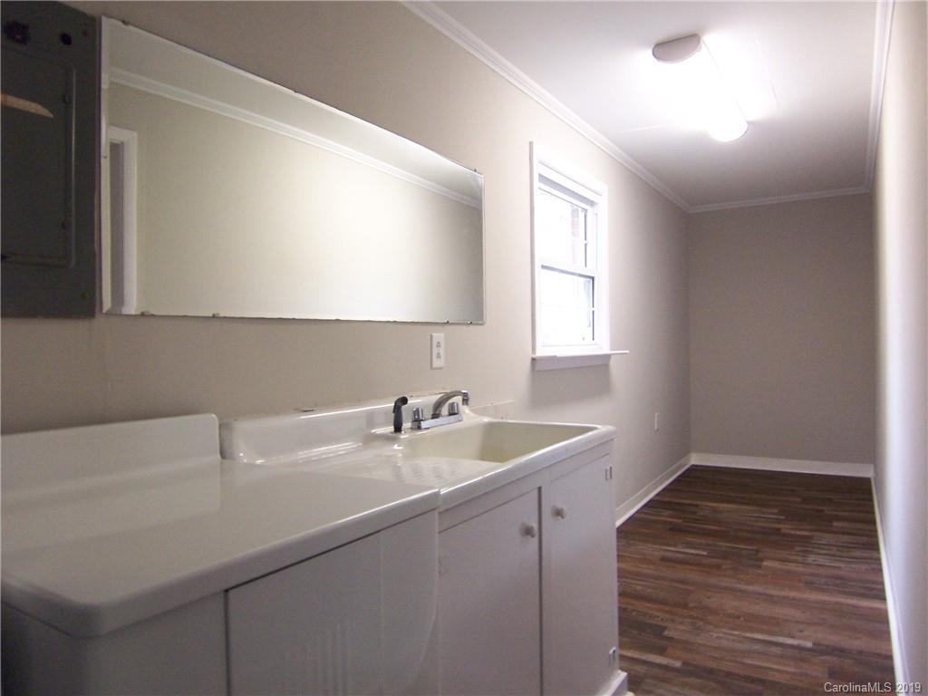 3804 Fallston Road Shelby, NC 28150 - Photo 9 of 24 a kitchen with a sink cabinets and a window