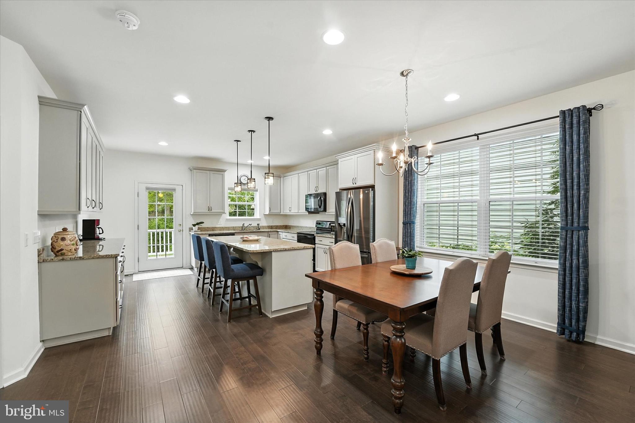 167 Sirius Drive Bear, DE 19701 - Photo 11 of 47 a dining room with furniture window and wooden floor