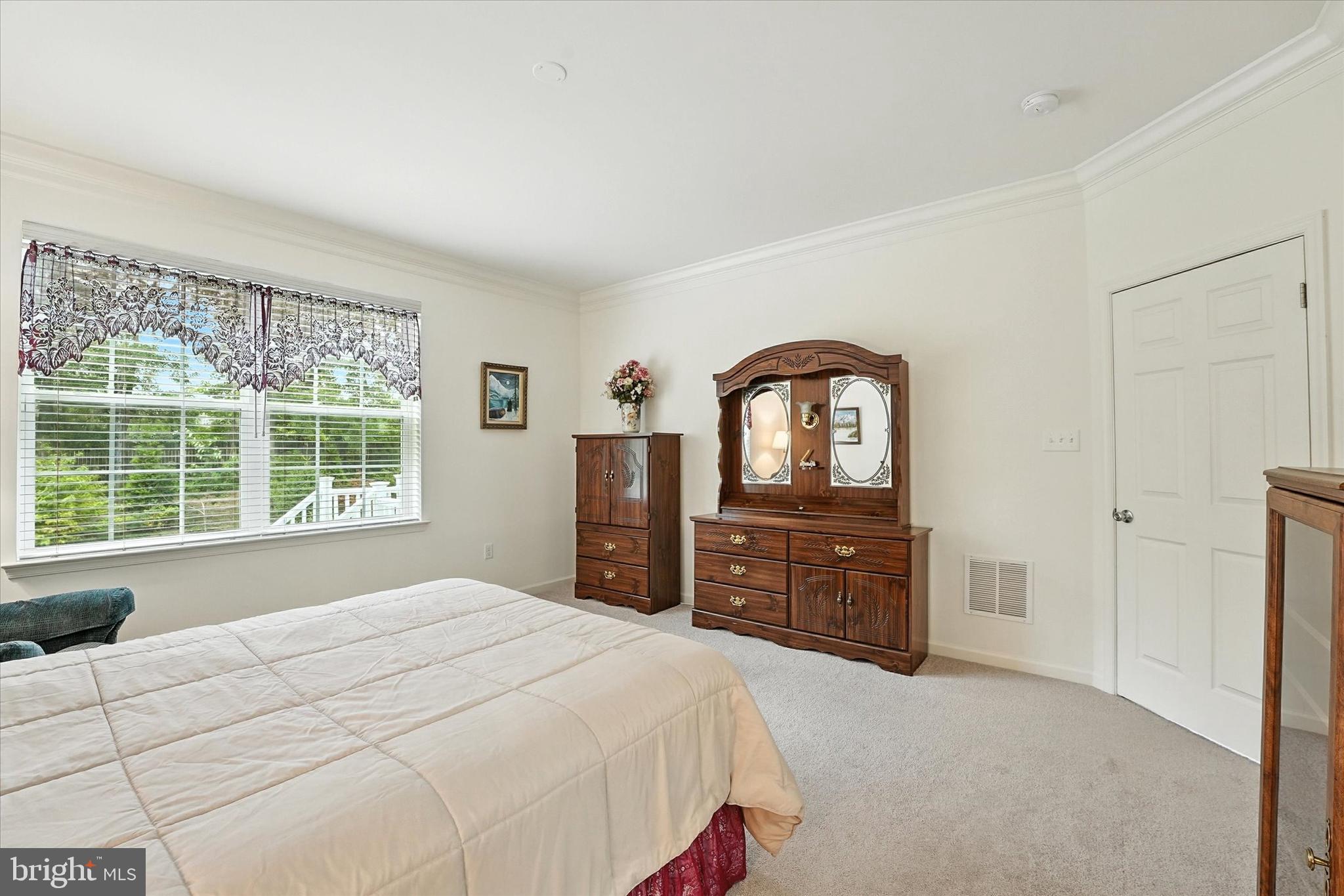 167 Sirius Drive Bear, DE 19701 - Photo 17 of 47 a bedroom with a bed dresser and a window