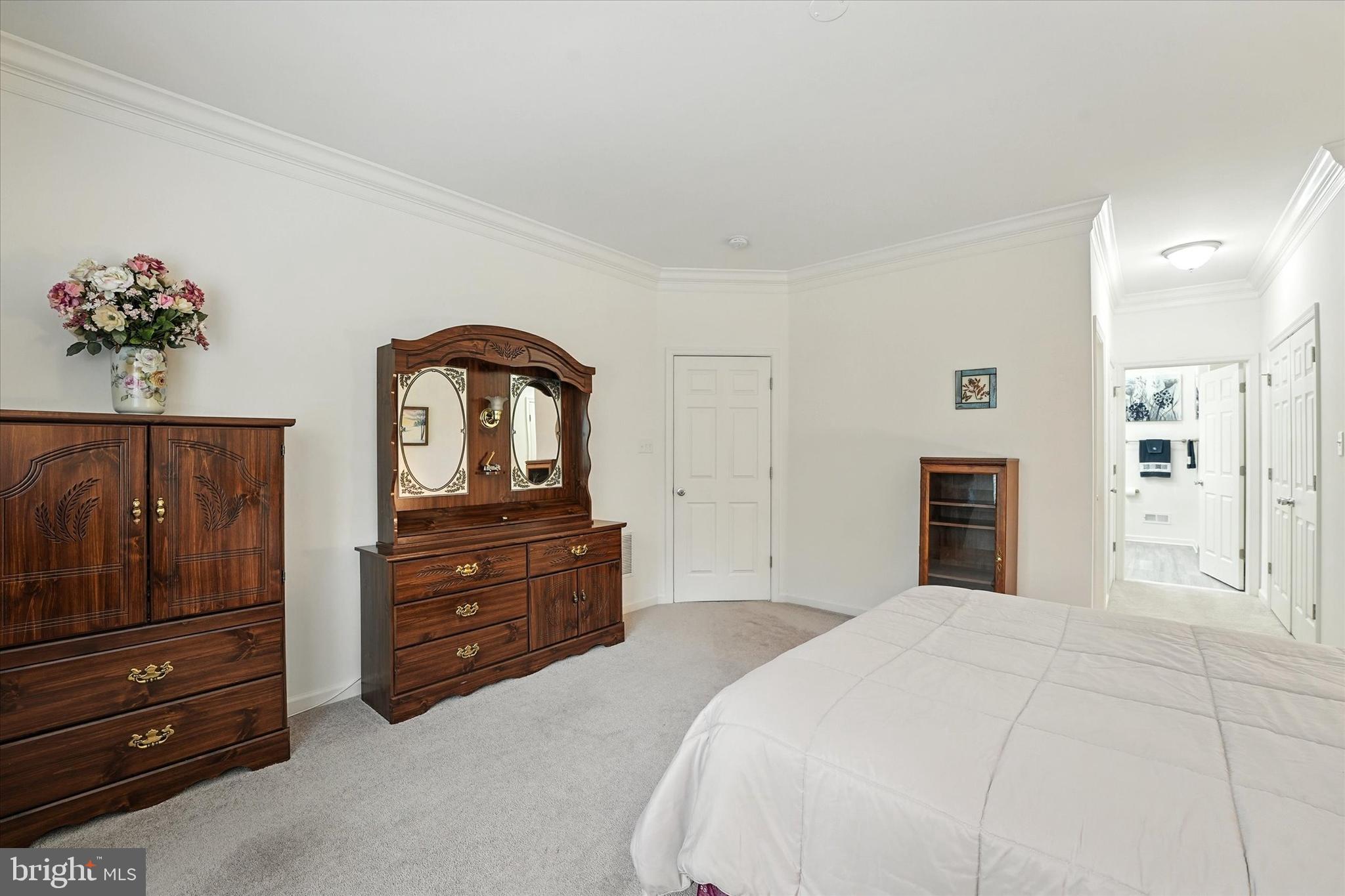 167 Sirius Drive Bear, DE 19701 - Photo 18 of 47 a bedroom with a bed and a dresser