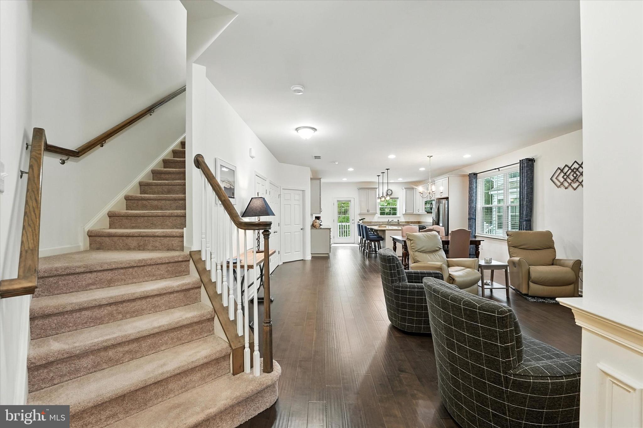 167 Sirius Drive Bear, DE 19701 - Photo 24 of 47 a view of entryway livingroom and hall with wooden floor