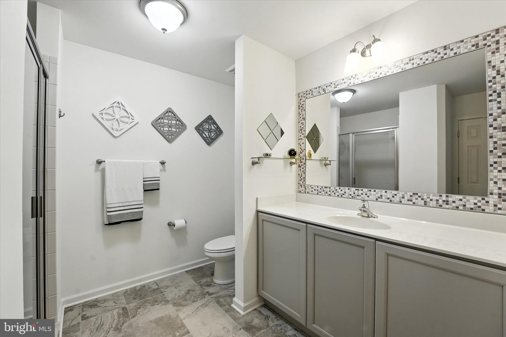 167 Sirius Drive Bear, DE 19701 - Photo 27 of 47 a bathroom with a sink a toilet and mirror