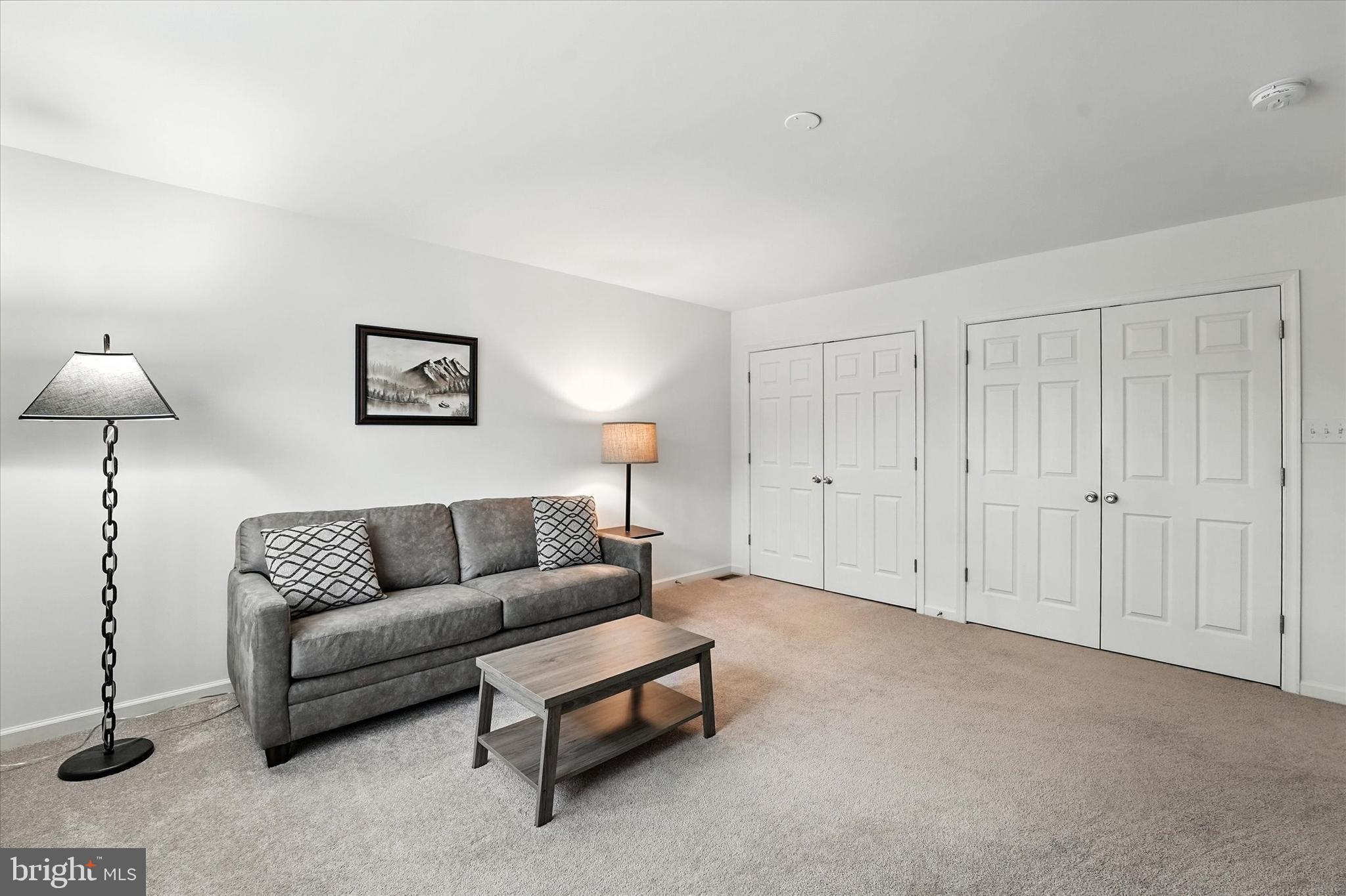 167 Sirius Drive Bear, DE 19701 - Photo 31 of 47 a living room with furniture and a lamp