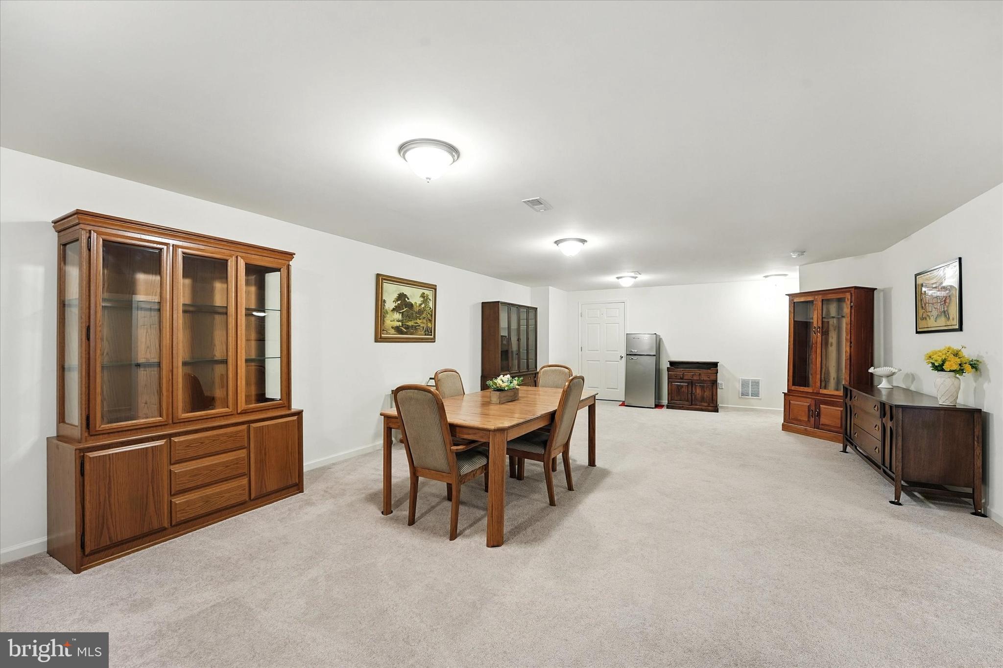 167 Sirius Drive Bear, DE 19701 - Photo 36 of 47 a living room with furniture a table and kitchen view