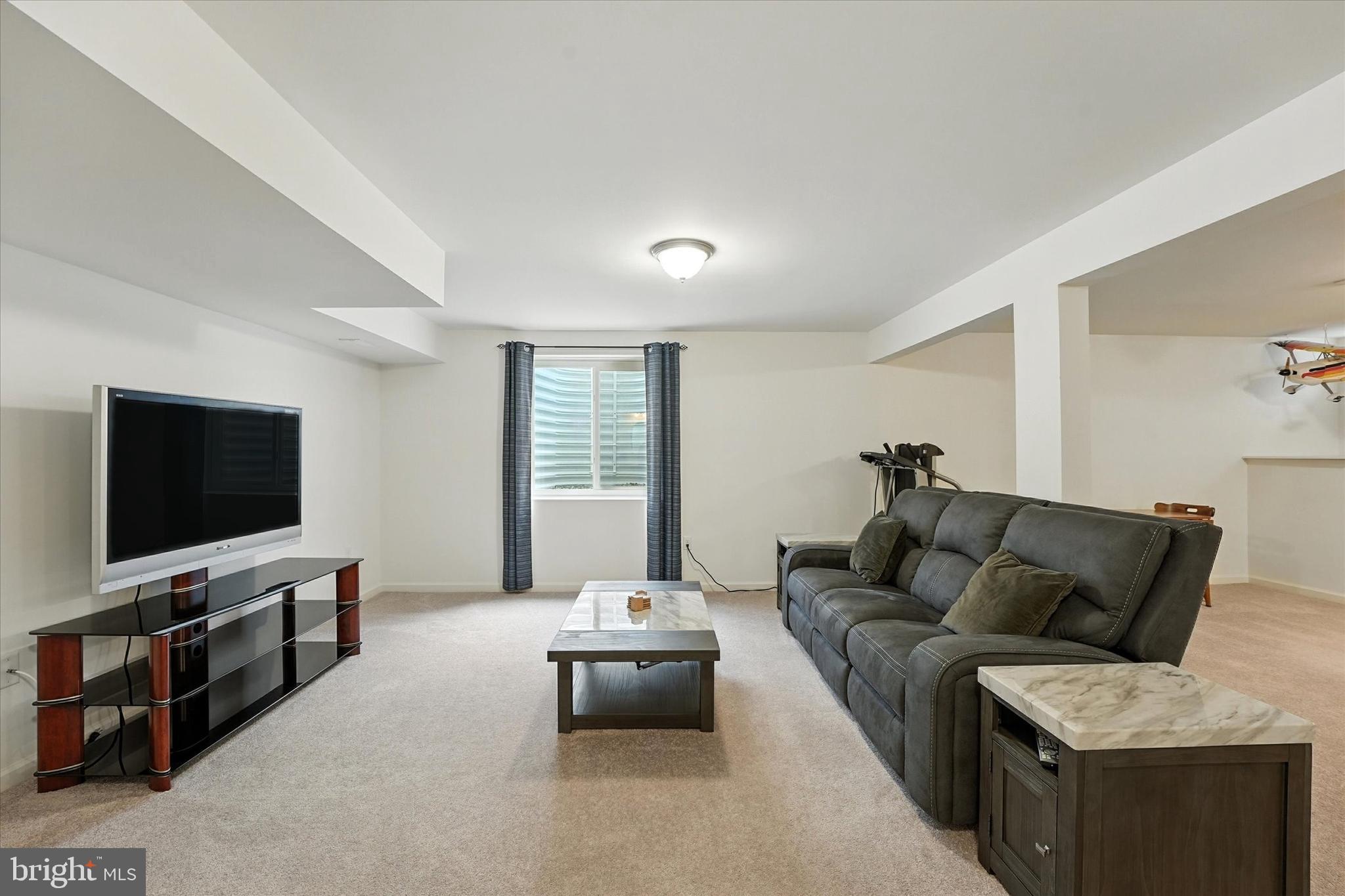 167 Sirius Drive Bear, DE 19701 - Photo 37 of 47 a living room with furniture and a flat screen tv