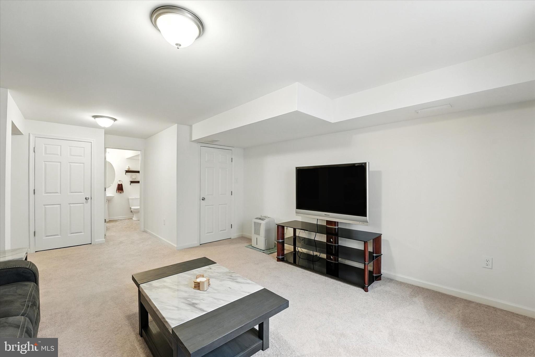 167 Sirius Drive Bear, DE 19701 - Photo 38 of 47 a living room with furniture and a flat screen tv