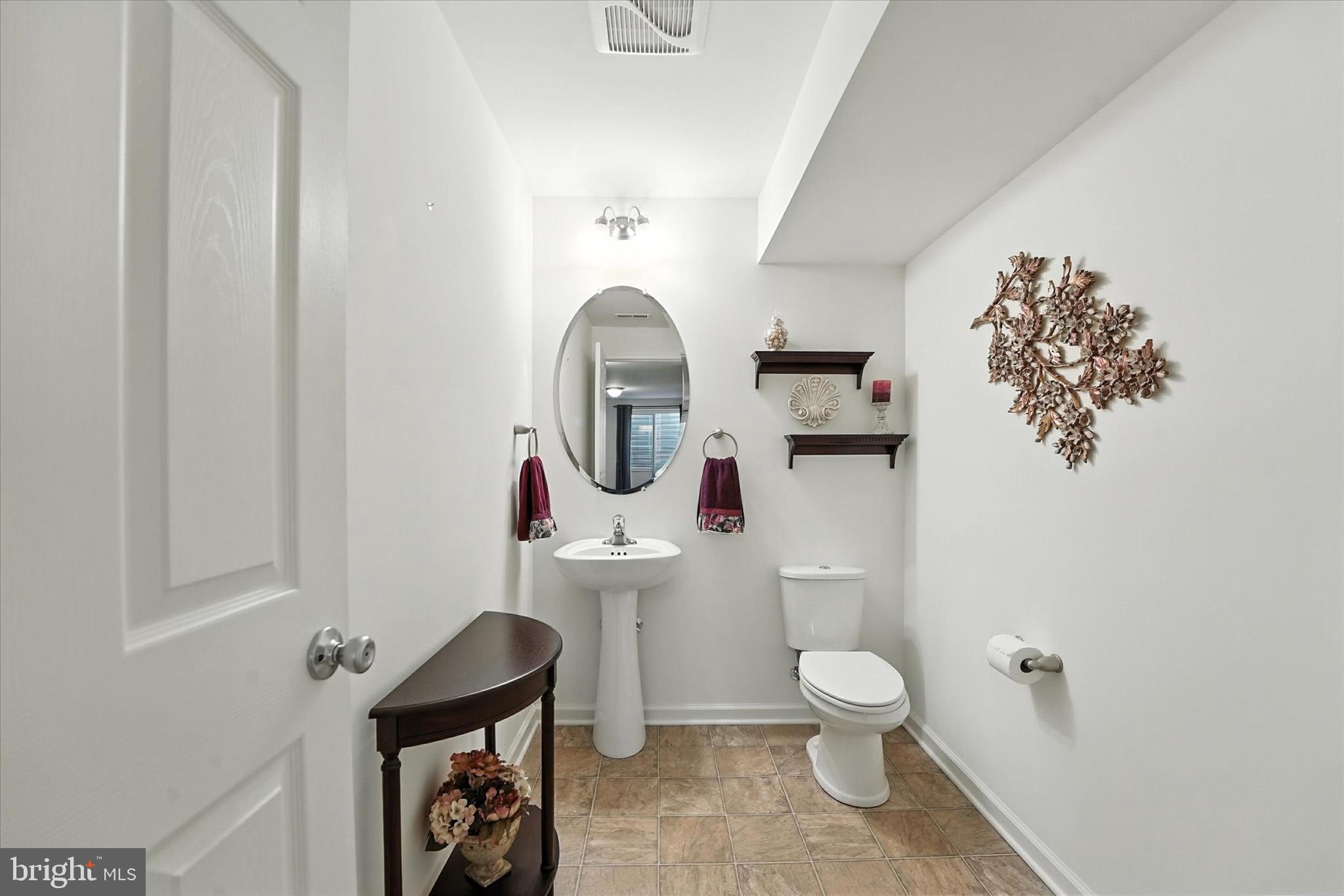 167 Sirius Drive Bear, DE 19701 - Photo 39 of 47 a bathroom with a toilet a sink and mirror