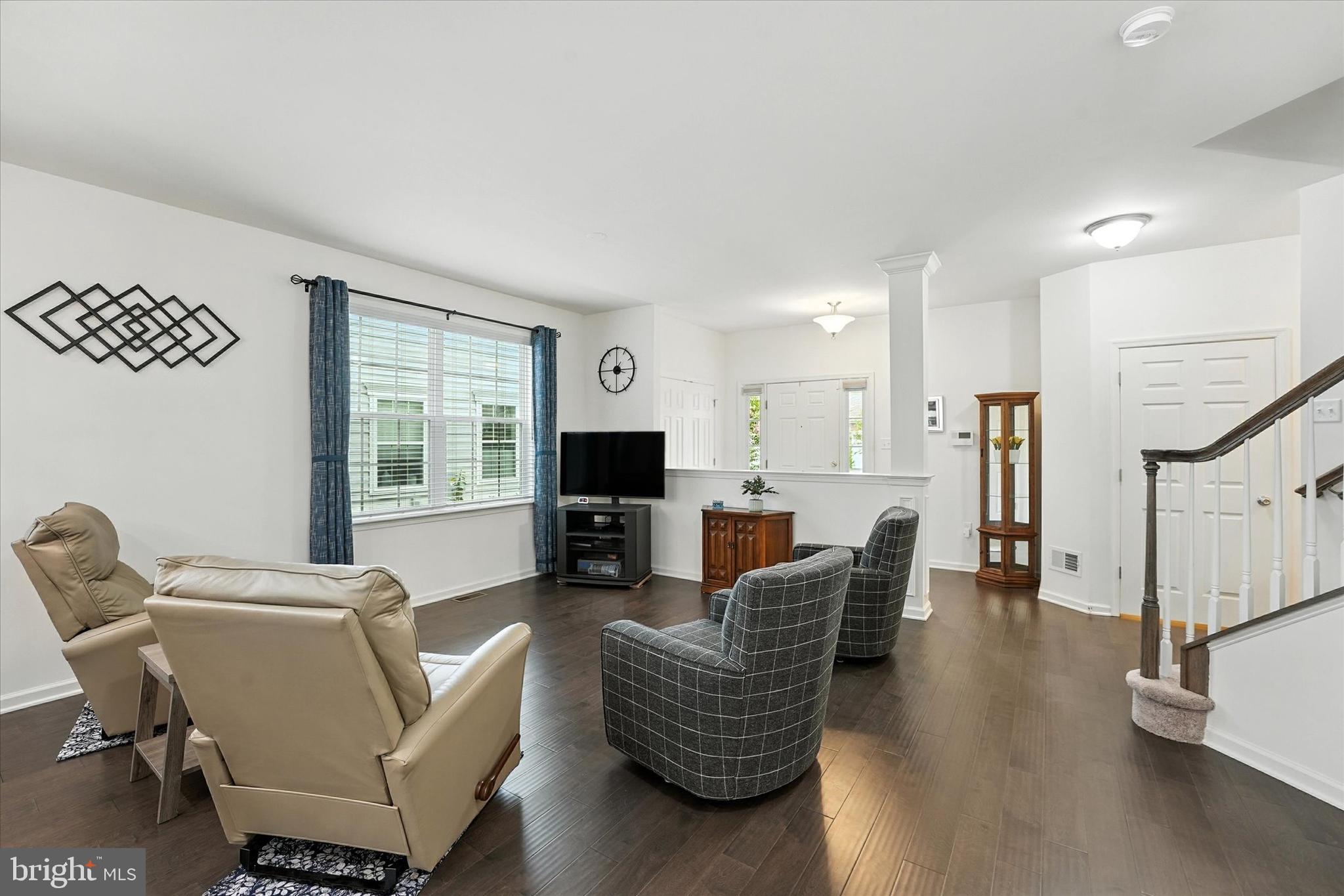 167 Sirius Drive Bear, DE 19701 - Photo 7 of 47 a living room with furniture a flat screen tv and a large window