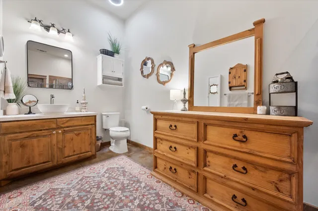 a bathroom with a shower a sink and a mirror