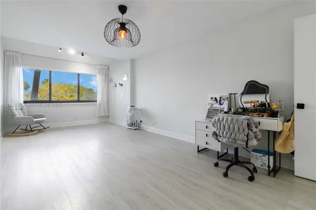 a view of a bathroom with wooden floor