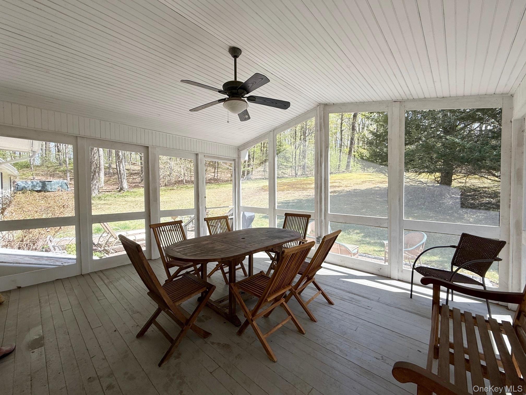 230 Cooper Road Millerton, NY 12546 - Photo 4 of 20 a dining room with furniture window and wooden floor