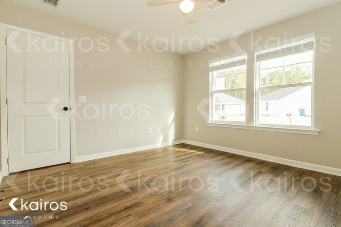 126 Cottage Grove Road Brunswick, GA 31525 - Photo 13 of 17 a view of an empty room with a window