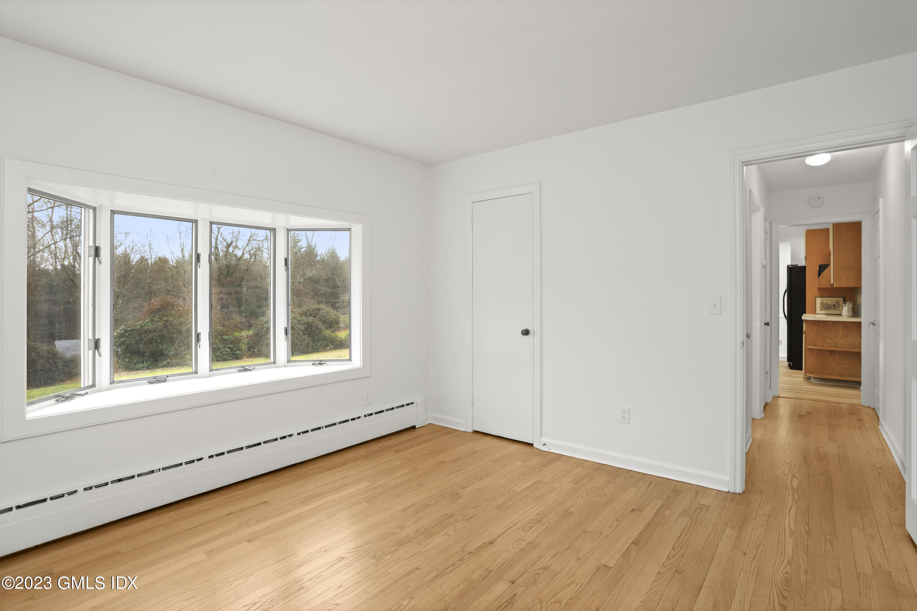 148 Old Mill Road Greenwich, CT 06831 - Photo 19 of 39 FAMILY ROOM INTO HALL GOING TO KITCHEN