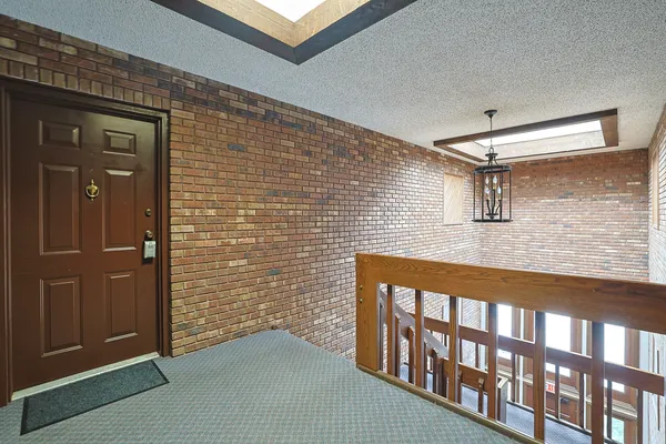 a view of a brick house with an entryway