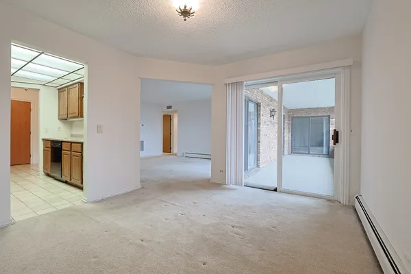 a view of empty room with a fireplace