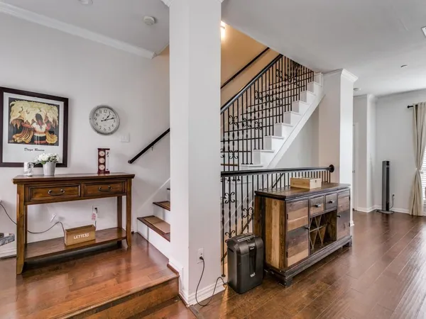 a view of entryway livingroom and hall with wooden floor