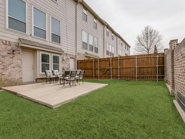 a view of backyard with a garden and plants