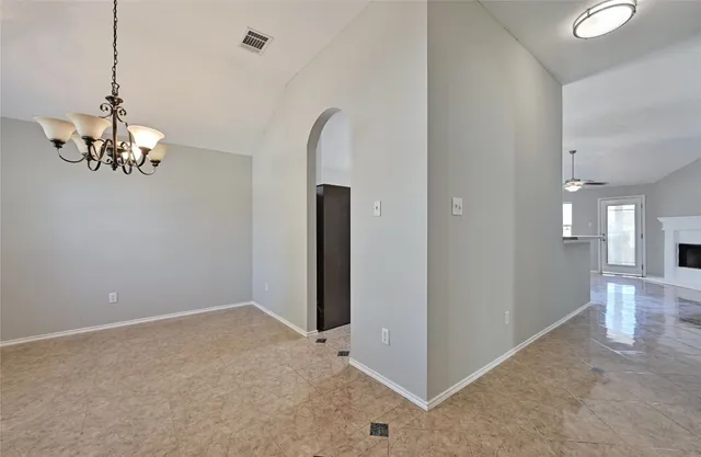 a view of a chandelier in big room and chandelier