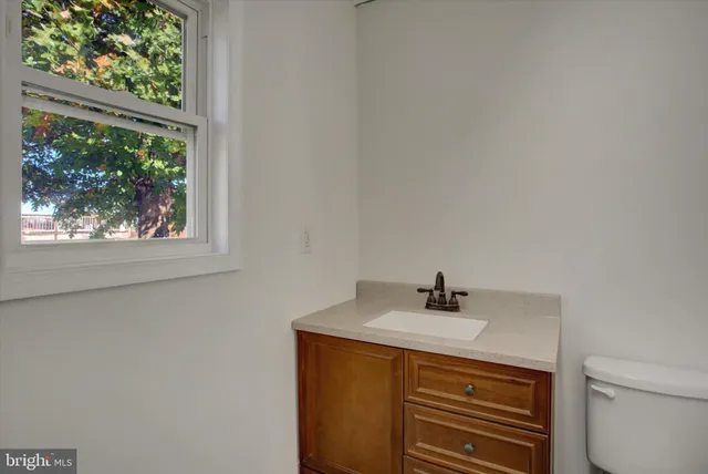 a sink a window and a mirror