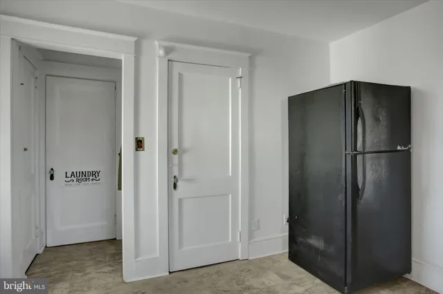 a view of elevator with hallway kitchen