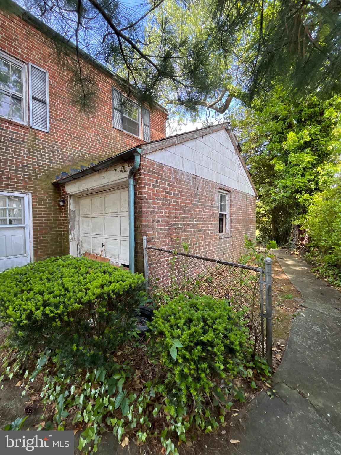 5906 Ayleshire Road Baltimore, MD 21239 - Photo 33 of 41 Attached garage with windows and slate roof.