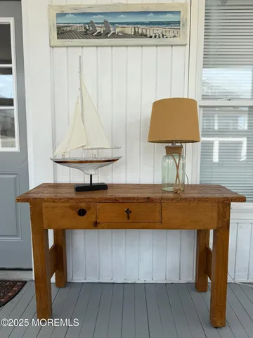 a view of a room with a table and chairs