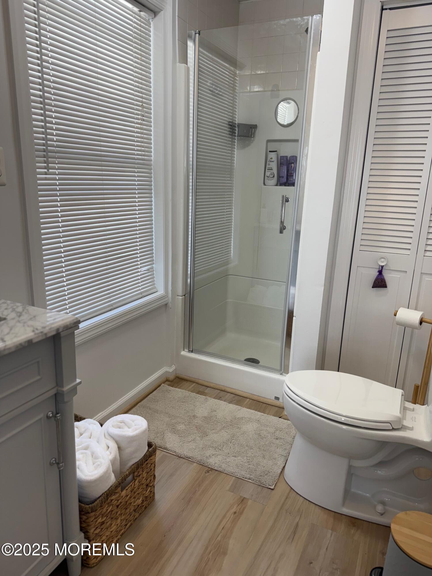 191 3rd Avenue, Unit 1 Manasquan, NJ 08736 - Photo 12 of 13 a bathroom with a toilet and a shower