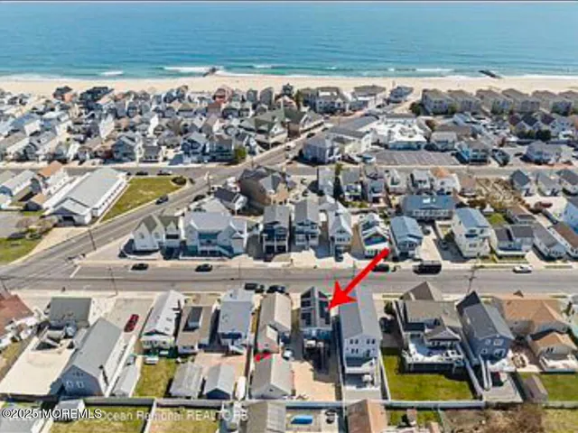 a view of multiple houses with a swimming pool