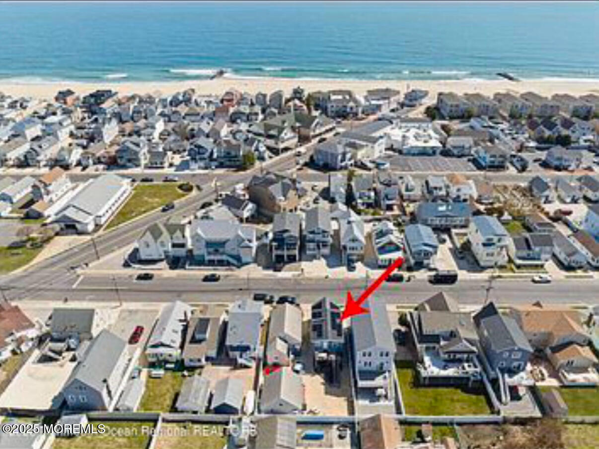 191 3rd Avenue, Unit 1 Manasquan, NJ 08736 - Photo 2 of 13 a view of multiple houses with a swimming pool