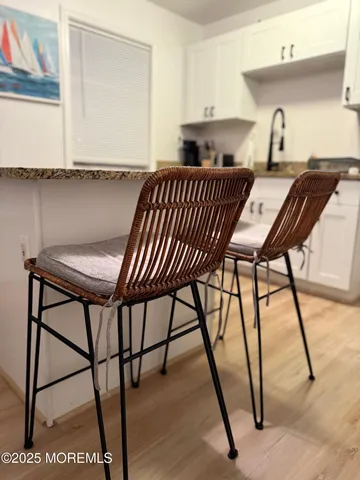 a view of a dining room with furniture and a window