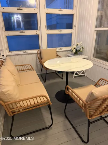 a room with furniture and wooden floor