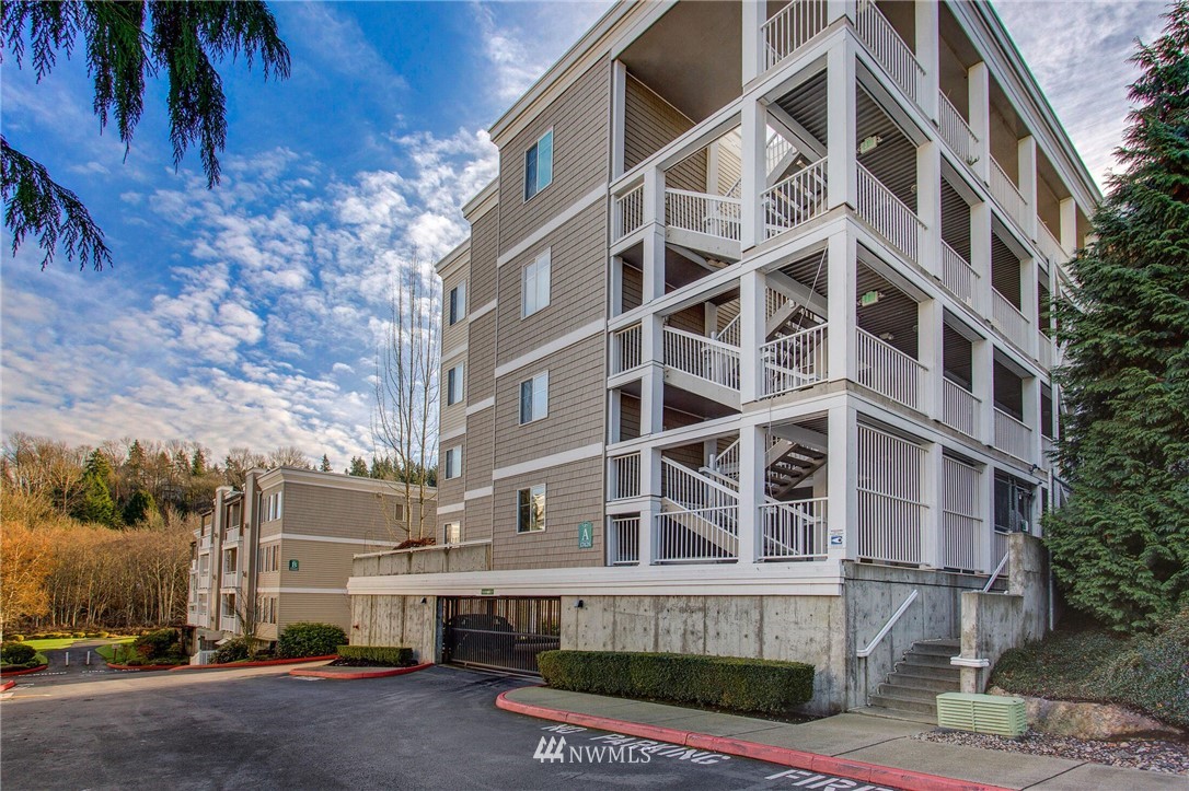 17426 Bothell Way Northeast, Unit A402 Bothell, WA 98011 - Photo 2 of 29 a tall building with a lot of windows