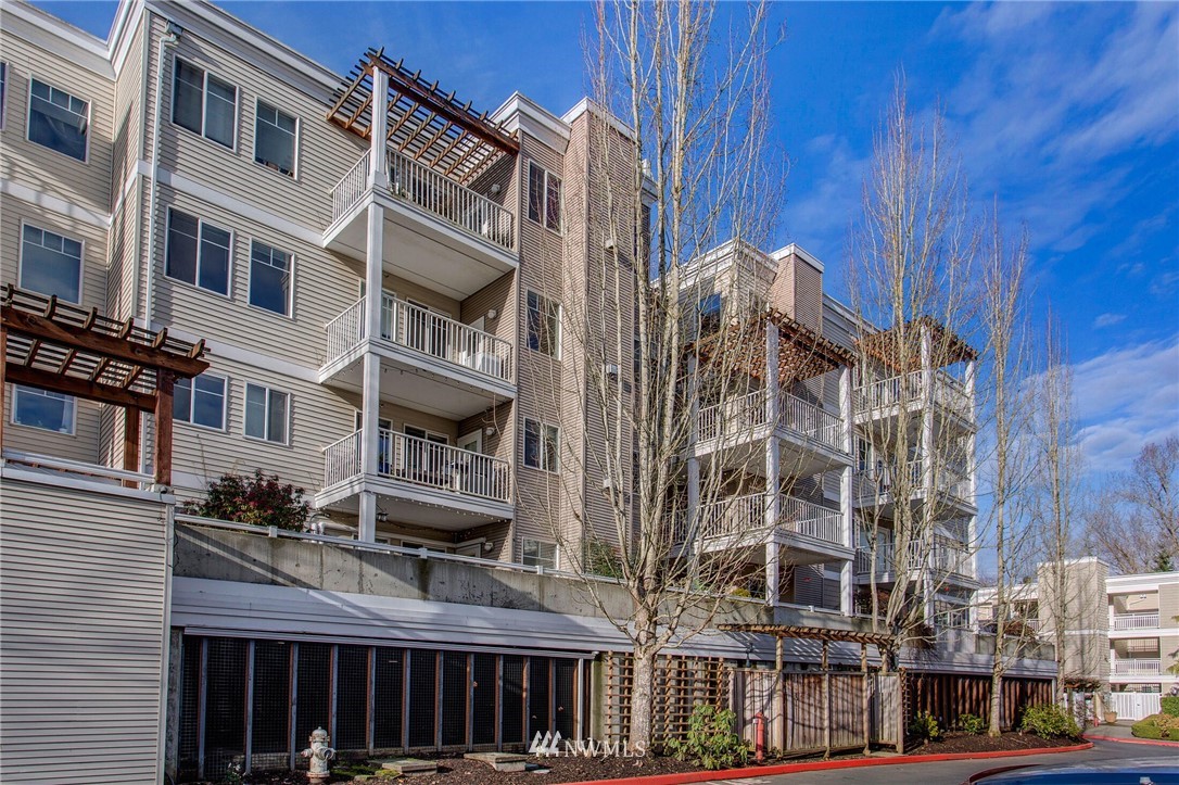 17426 Bothell Way Northeast, Unit A402 Bothell, WA 98011 - Photo 3 of 29 a front view of a building with glass windows
