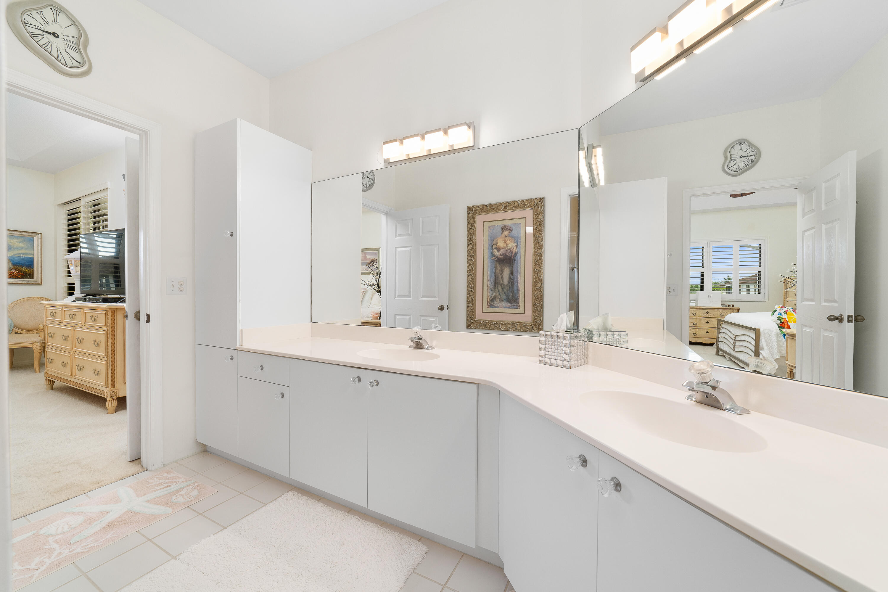 6121 Southeast Landing Way, Unit 12 Stuart, FL 34997 - Photo 24 of 47 a spacious bathroom with a double vanity sink mirror and