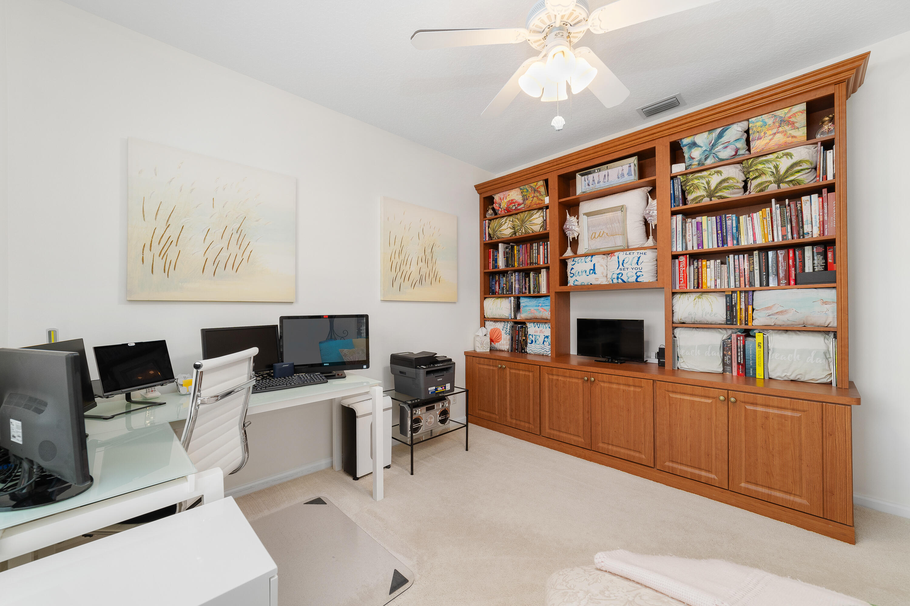 6121 Southeast Landing Way, Unit 12 Stuart, FL 34997 - Photo 26 of 47 a view of a workspace with furniture and a fireplace